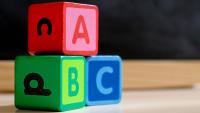A, B, and C wooden blocks stacked in a pyramid.